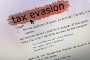 'Tax Evasion' definition dictionary with mouse arrow on computer screen